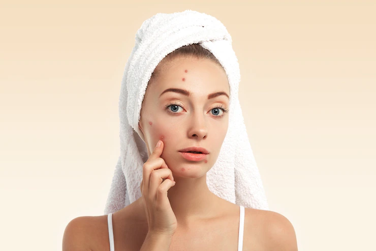 A professional aesthetician using a microcurrent device for skin tightening and facial lifting.